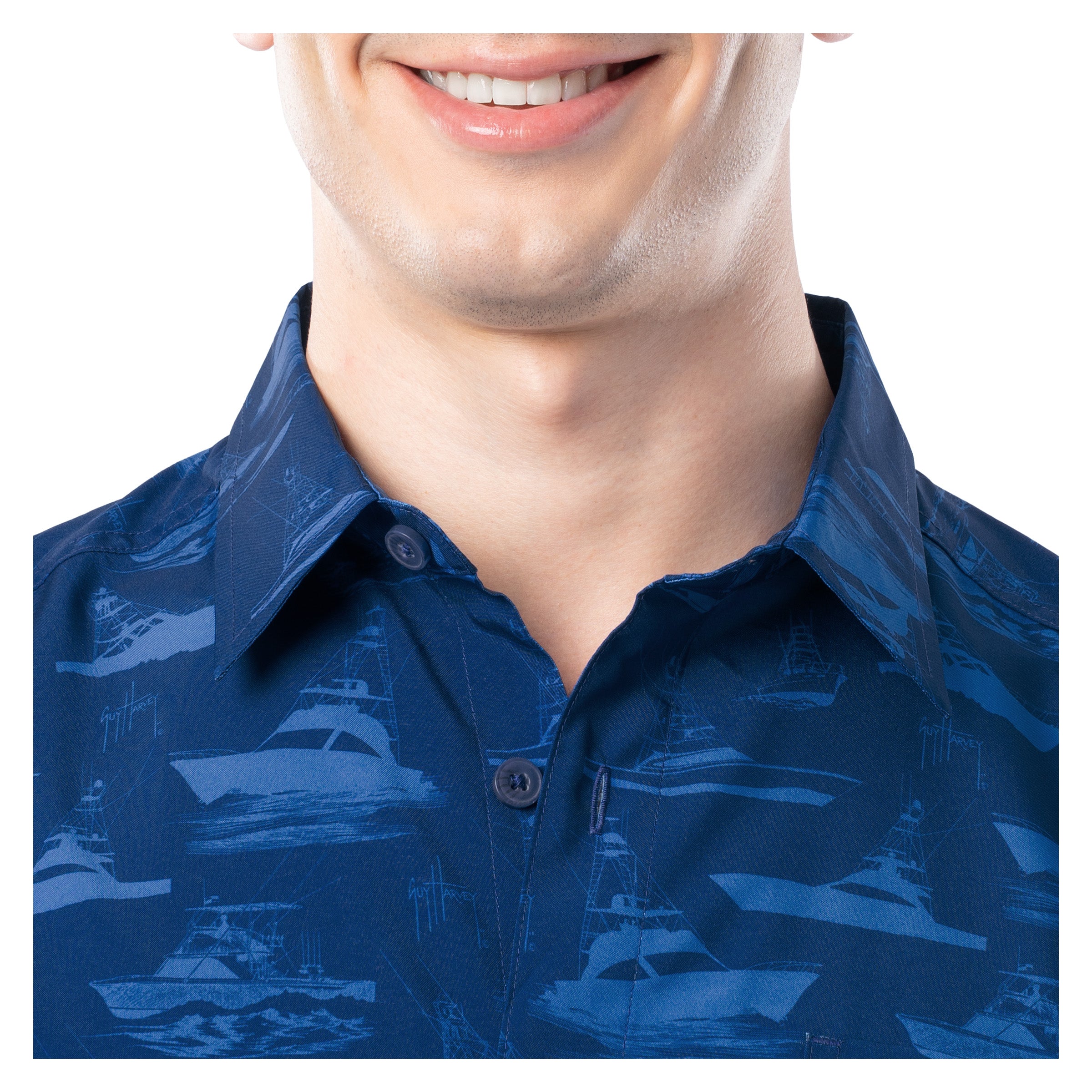 Close-up of a person wearing a blue patterned shirt on a white background