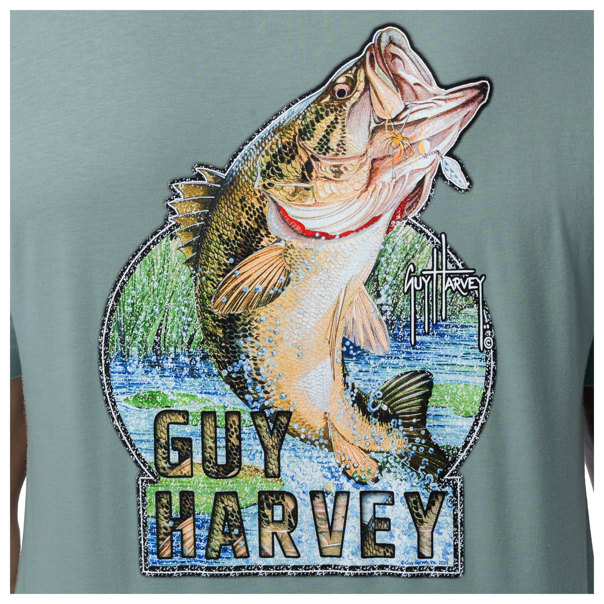 Close-up of largemouth bass artwork on green Guy Harvey freshwater fishing T-shirt