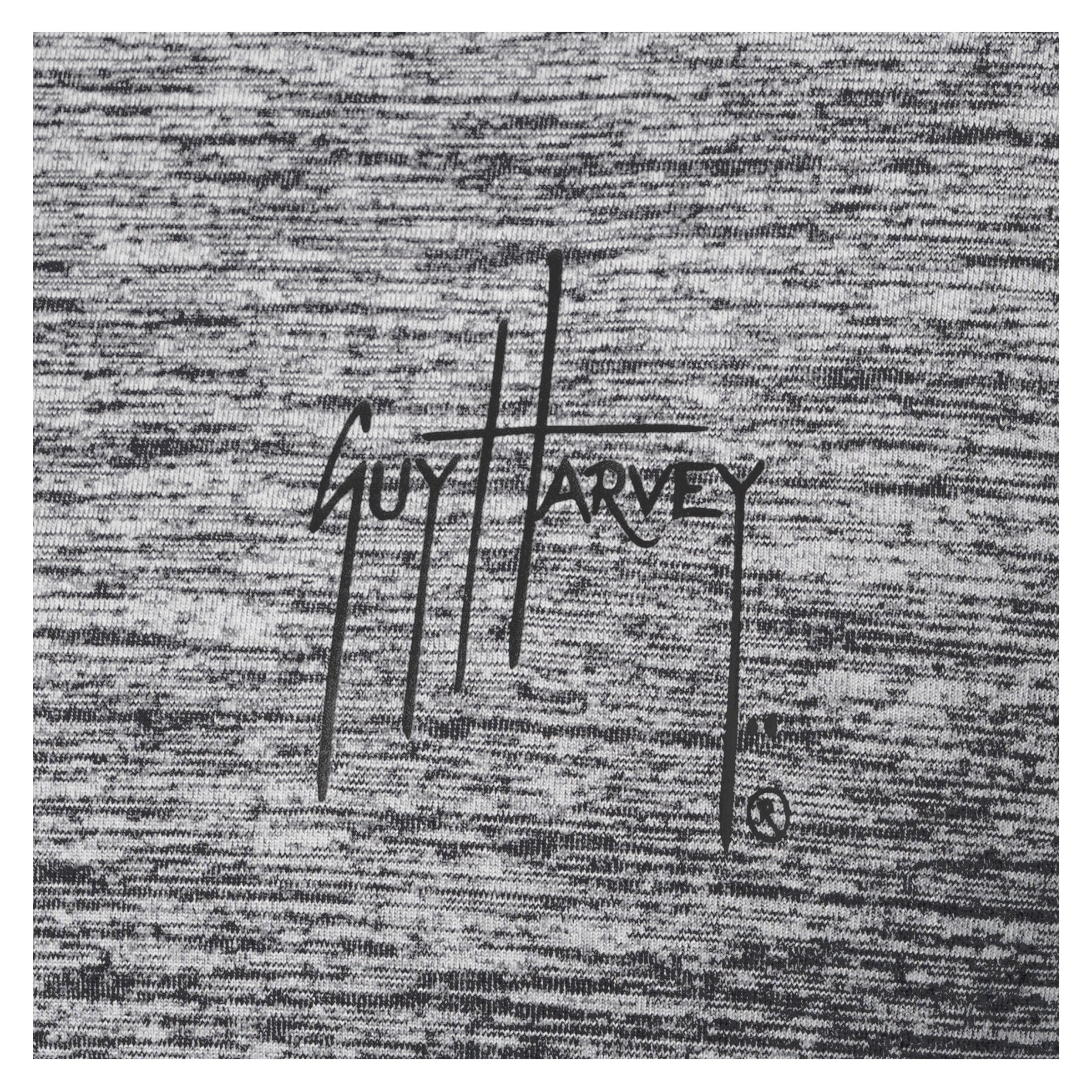 Close-up of black Guy Harvey logo printed on heather gray brushed fleece fabric