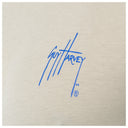 Blue signature on beige fabric background