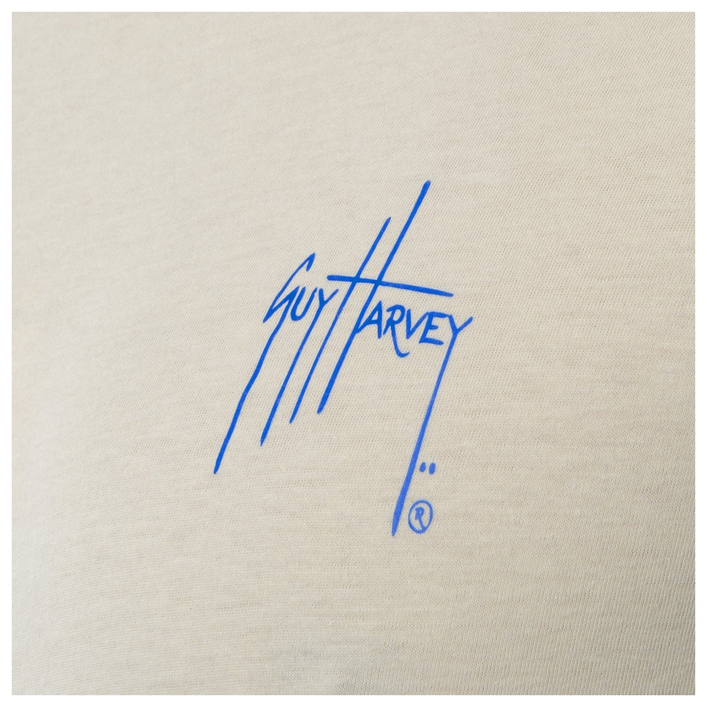 Blue signature on beige fabric background