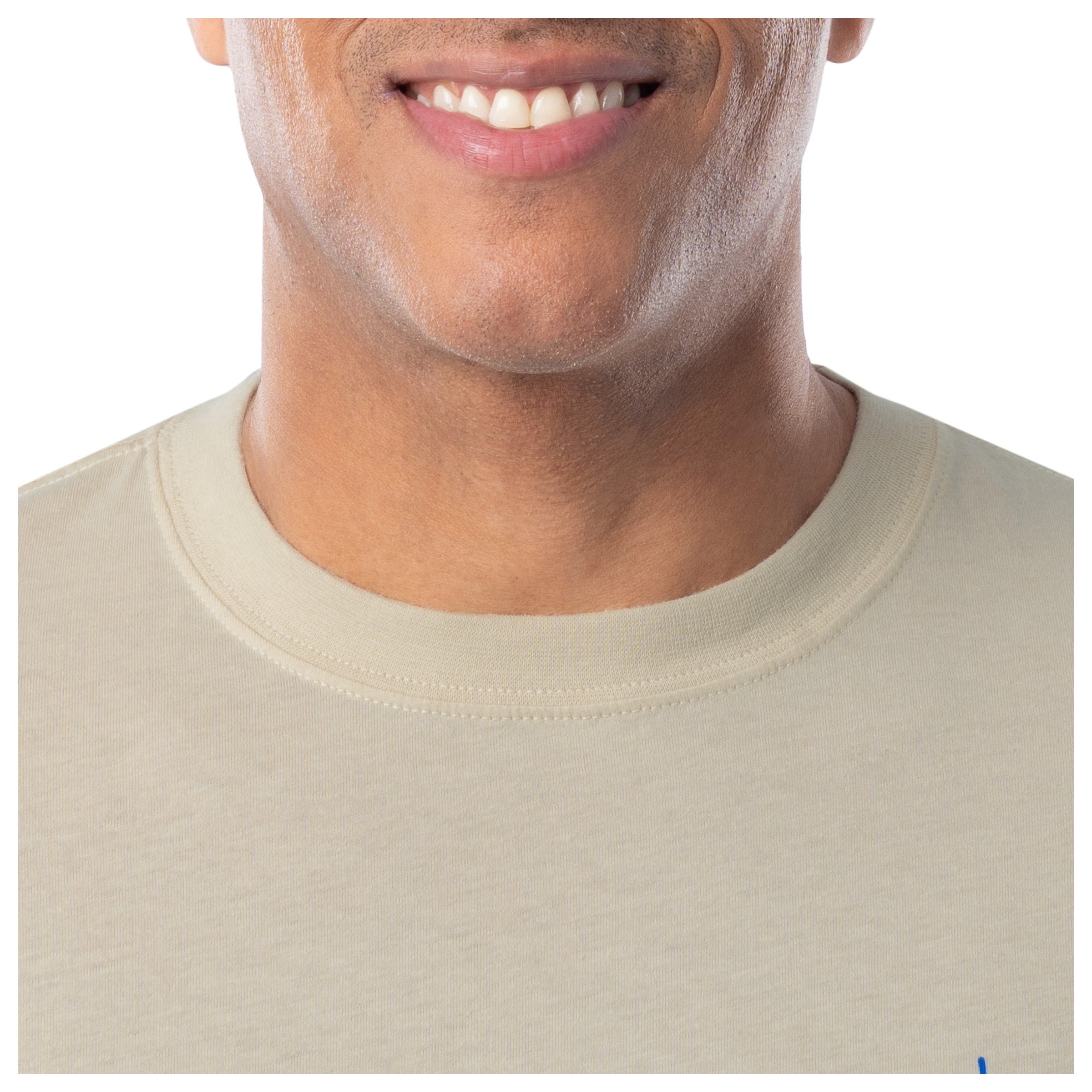 Close-up of a person wearing a beige t-shirt with a white background