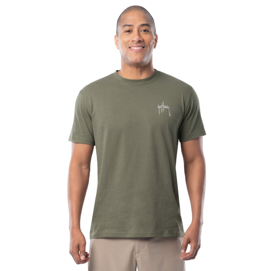 Man wearing a green t-shirt with a logo on a white background