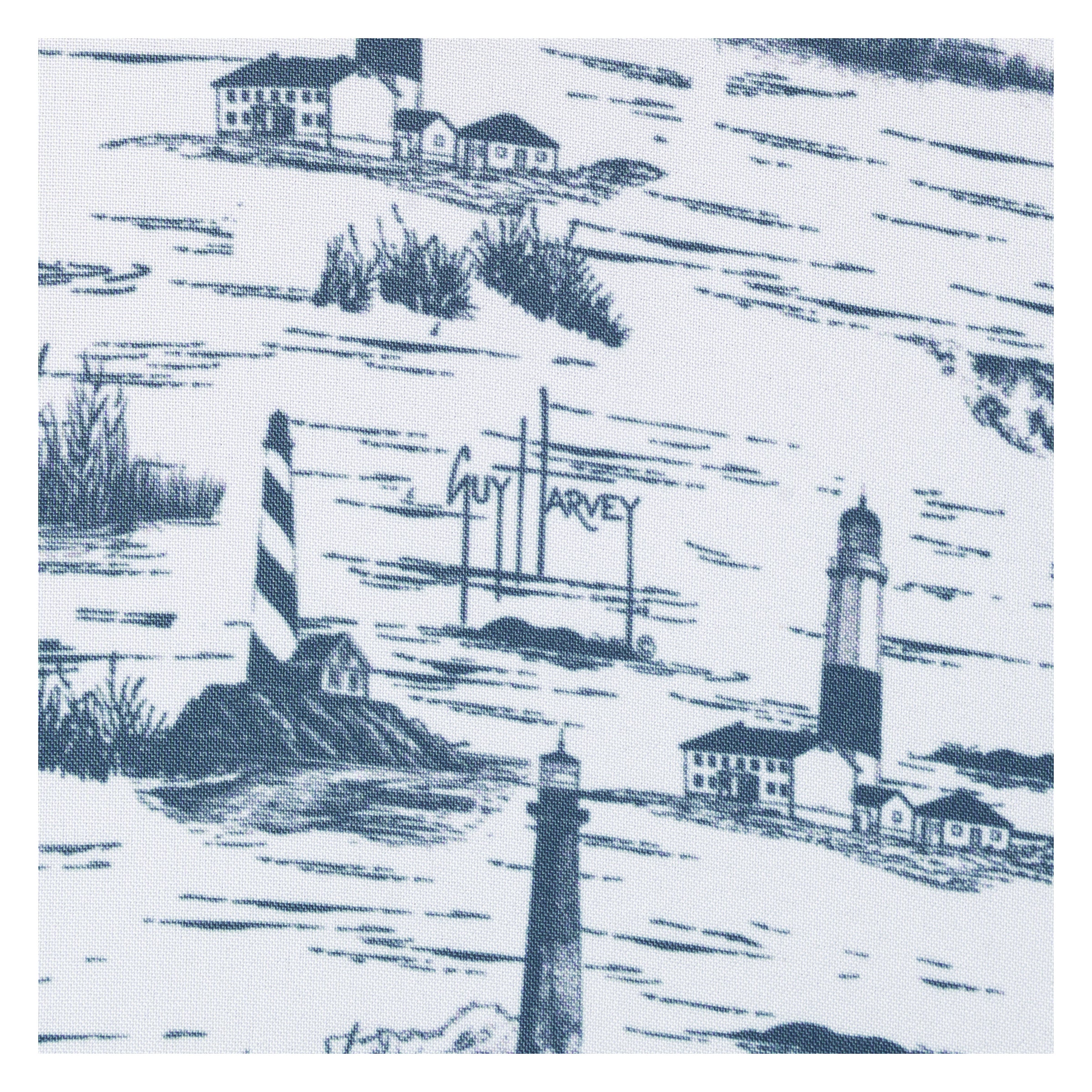 Fabric with blue and white design of lighthouses and houses, featuring the brand 'Guy Harvey'.