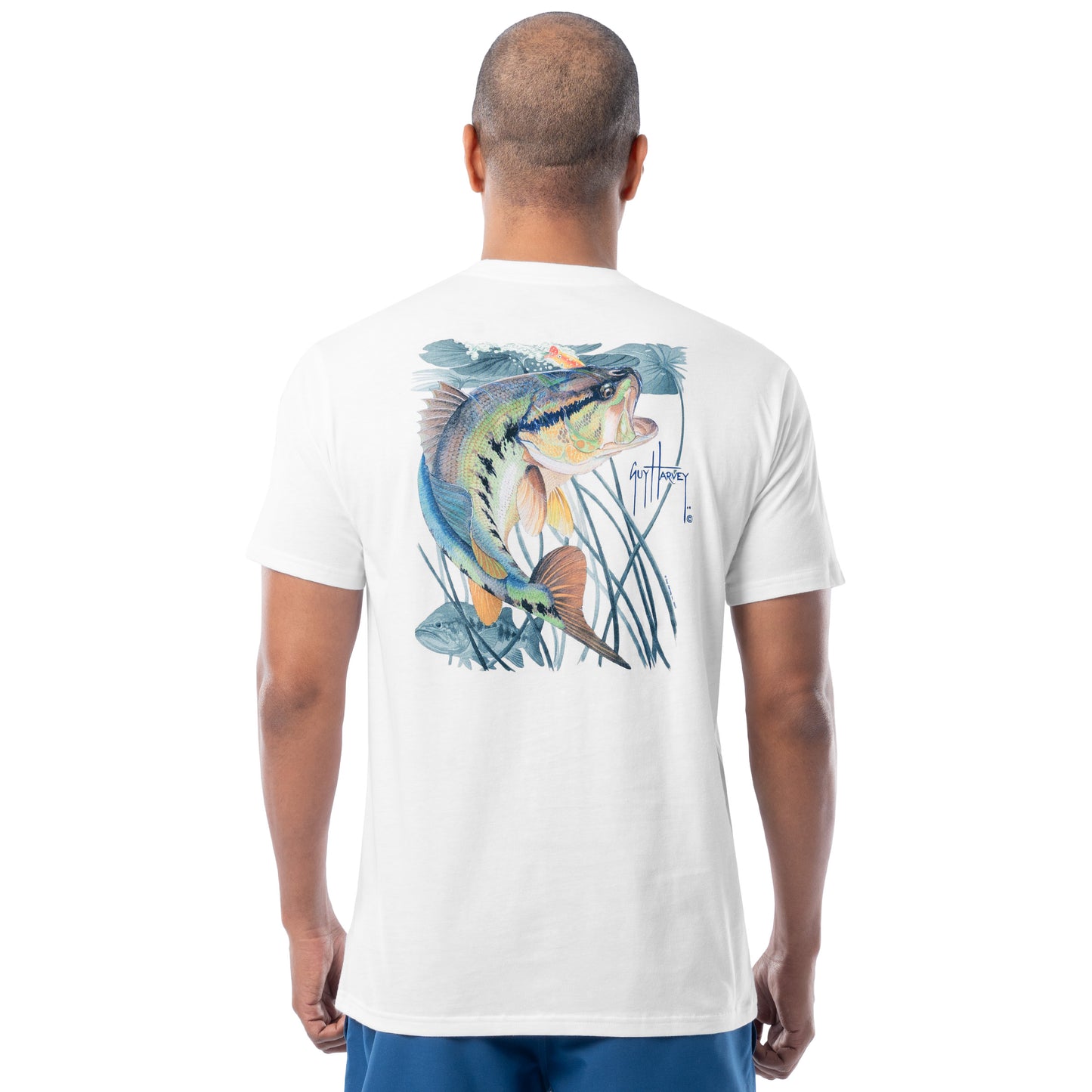 Man wearing a white t-shirt with a bass fish graphic on the back against a white background