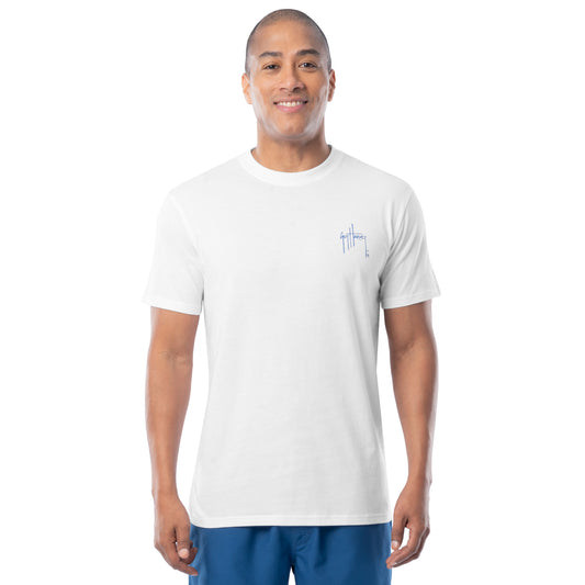 Man wearing a white t-shirt with a left chest Guy Harvey logo on a white background
