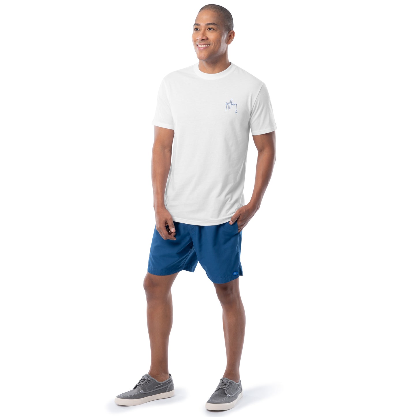 Man wearing a white t-shirt and blue shorts on a white background