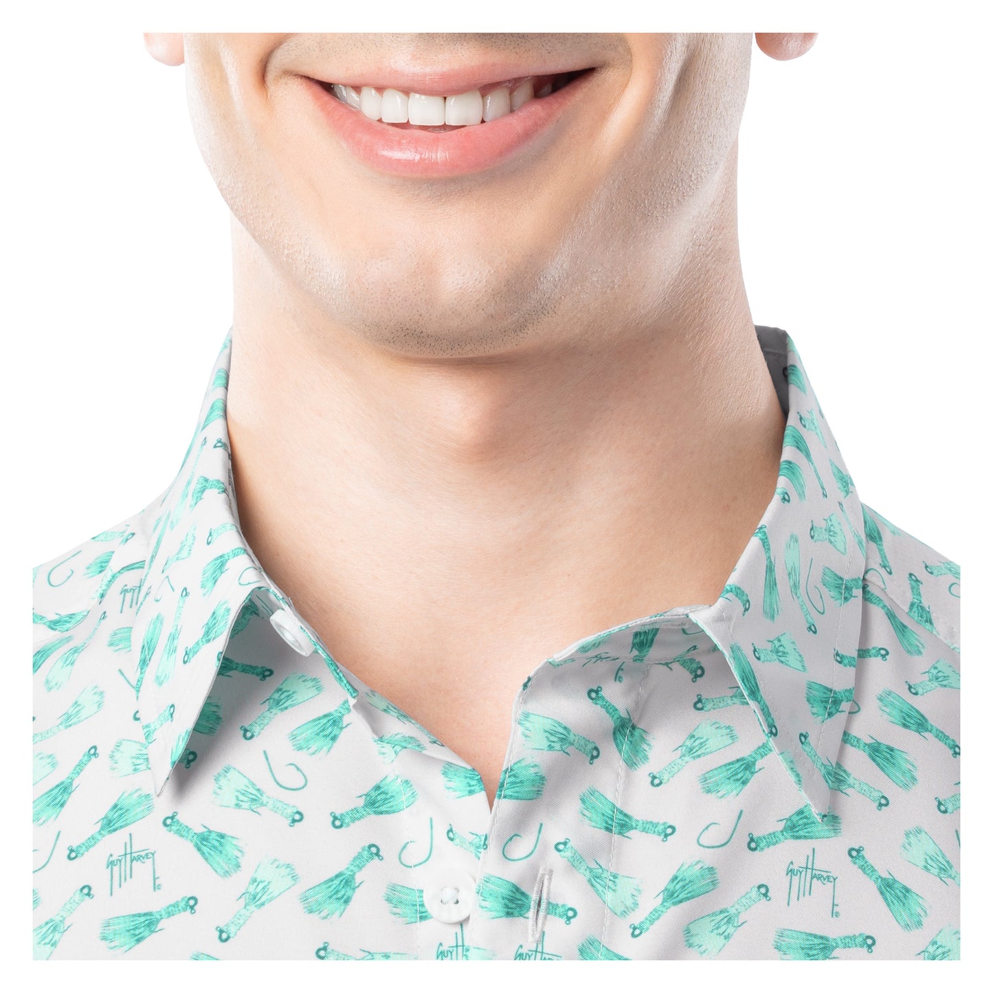 Close-up of a person wearing a shirt with a pattern of fishing-related items.