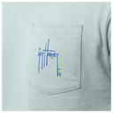 A close-up on the left chest pocket with the Guy Harvey signature logo