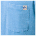 Close-up of a blue pocket with a brand label on a blue background