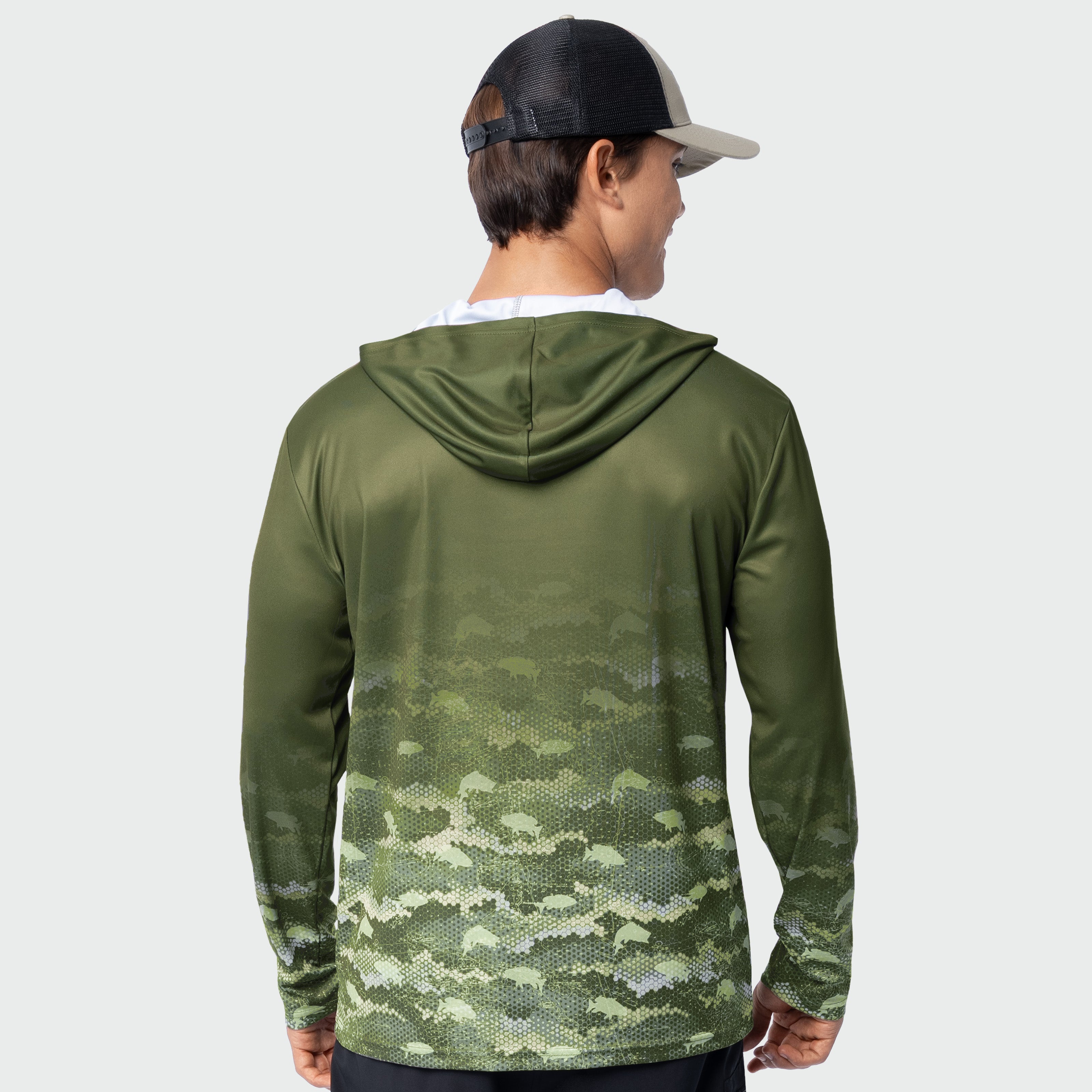 Person wearing a green camouflage hoodie on a white background