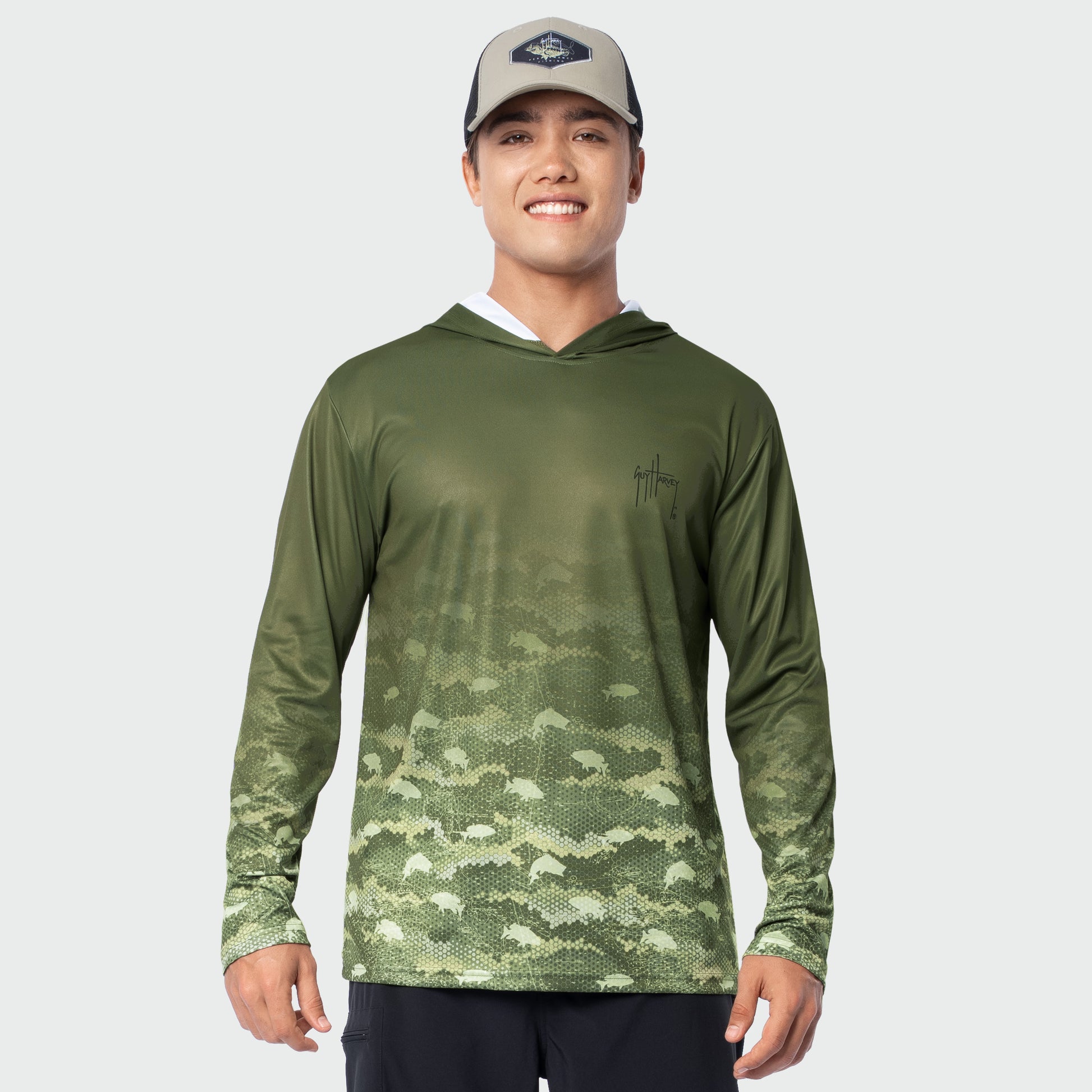 Man wearing a green camouflage sun protection hoodie on a white background
