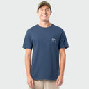 Man wearing a navy blue t-shirt with a logo on a light gray background