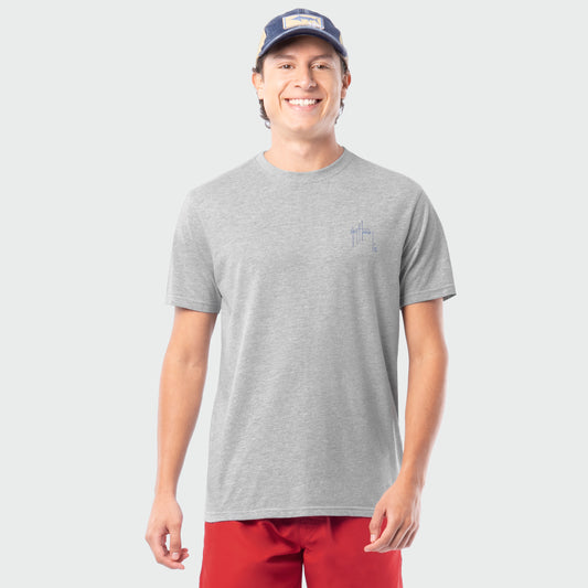 Man wearing a gray t-shirt and red shorts on a white background