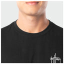 Black t-shirt with a brand logo on a plain background