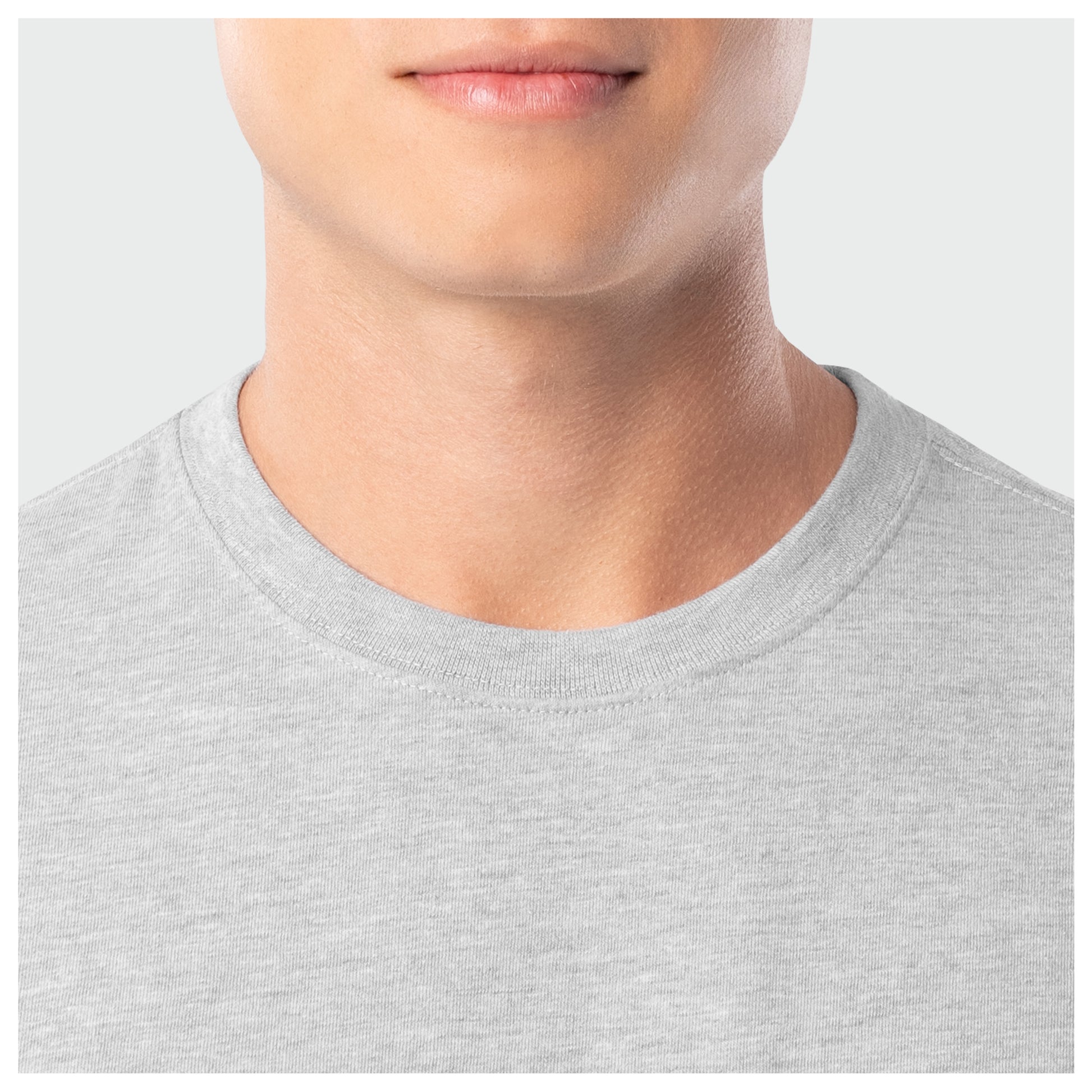 Close-up of a person wearing a gray t-shirt on a white background