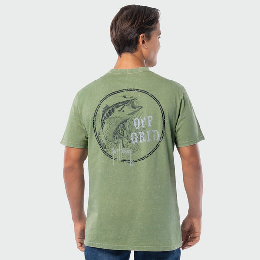 Person wearing a green washed t-shirt with a bass graphic design on the back against a white background