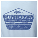 Light blue t-shirt with Guy Harvey saltwater fishing gear logo on a light blue background