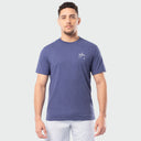 Man wearing a blue t-shirt with a Guy Harvey logo on a white background
