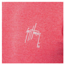 A close-up on the Guy Harvey logo placed on the left chest.