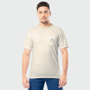 Man wearing a beige t-shirt with a pocket on a light gray background