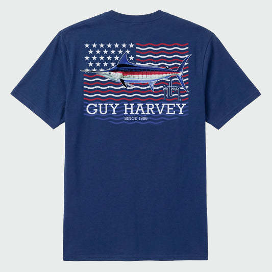Flat lay image of a blue Guy Harvey t-shirt with a marlin americana graphic design on the back against a white background