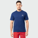 Man wearing a blue t-shirt with a logo on a white background