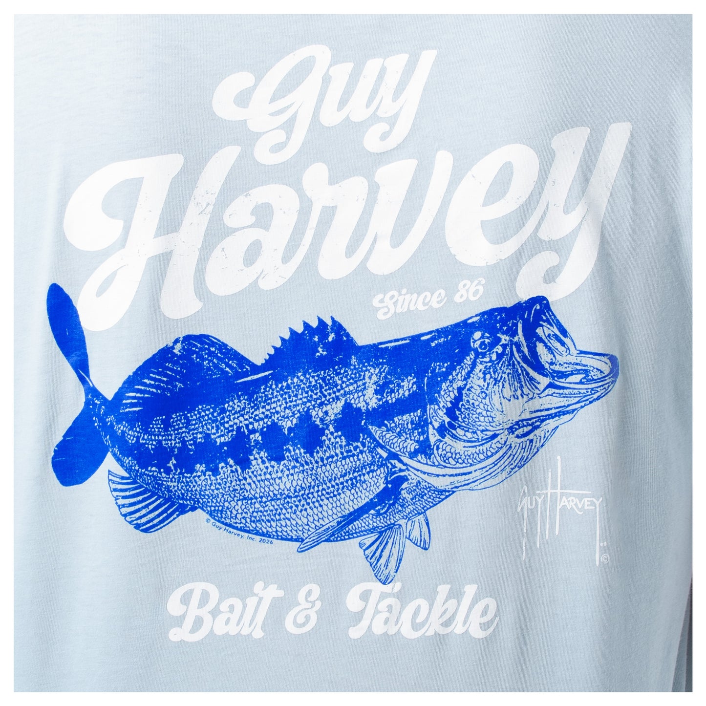 Light blue t-shirt with a bass fish graphic and 'Guy Harvey' branding.