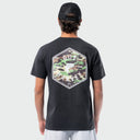 Person wearing a black t-shirt with a camouflage logo on the back against a white background