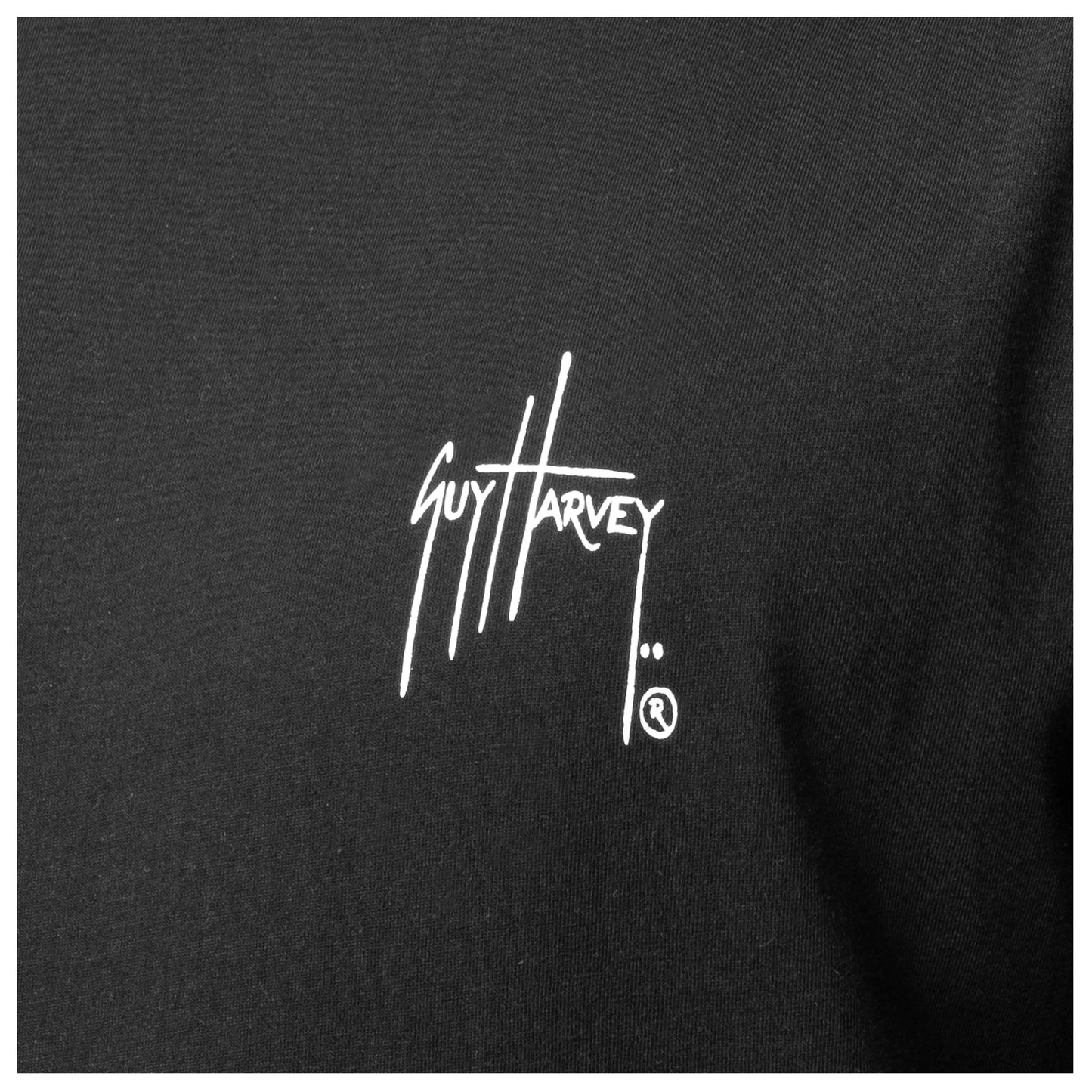 Black shirt with white Guy Harvey logo on a black background