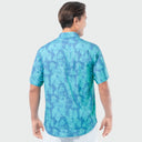 Man wearing a blue patterned shirt on a white background