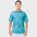 Man wearing a blue patterned Guy Harvey shirt on a white background