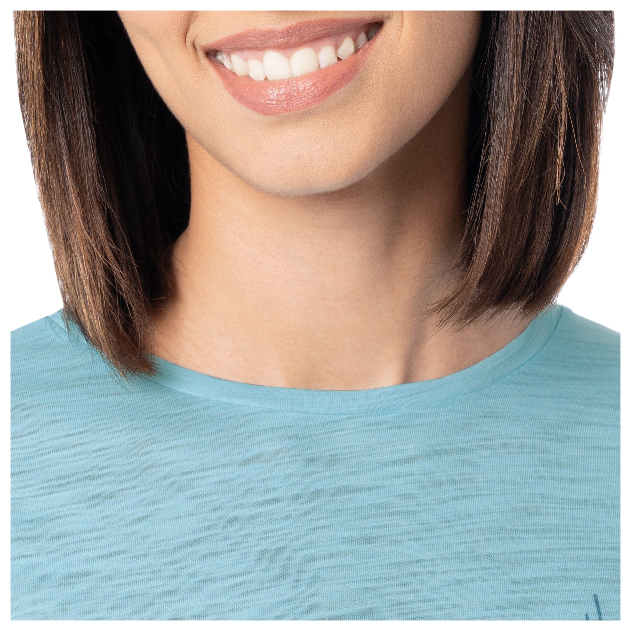 Close-up of a person wearing a light blue shirt with a blurred background