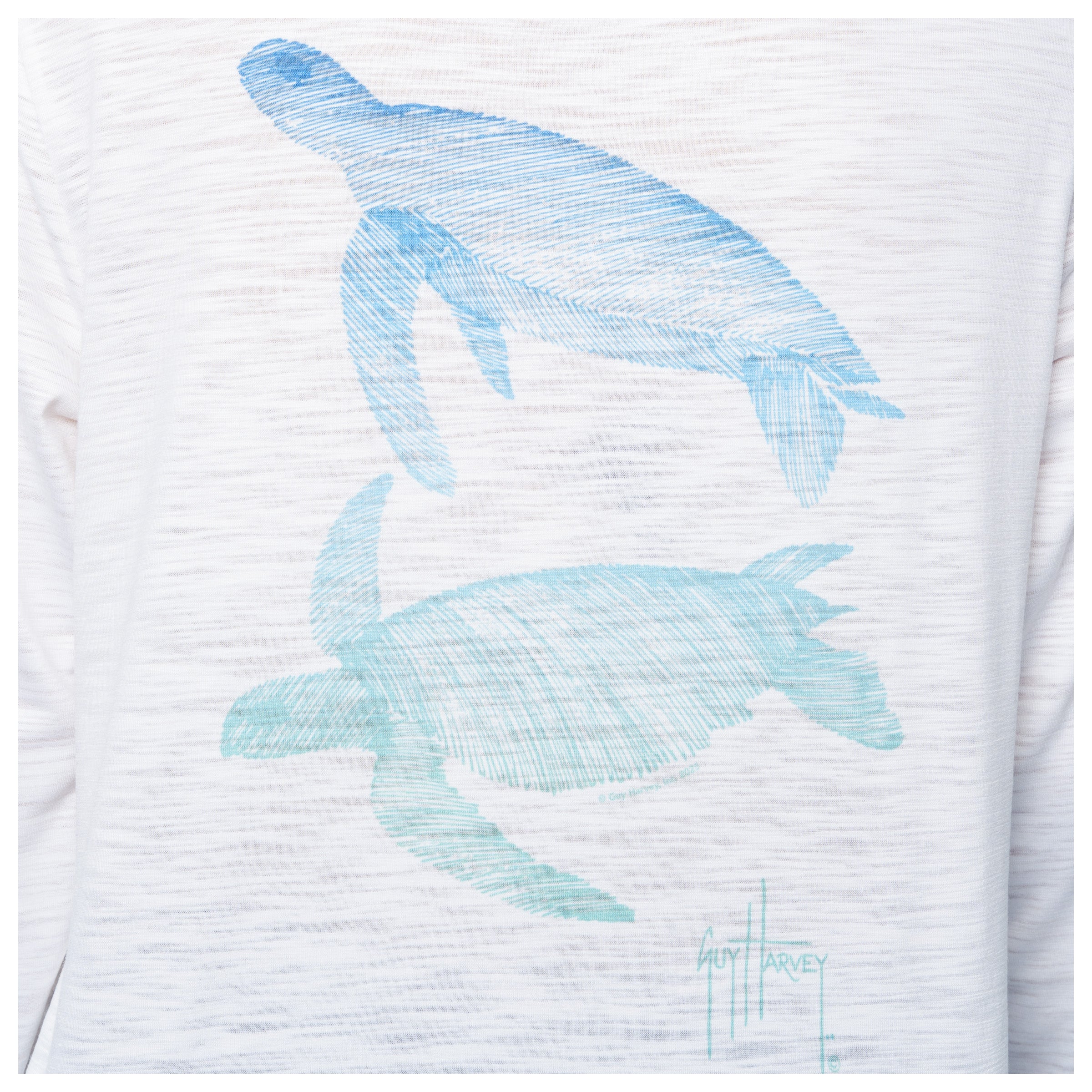 White shirt with blue turtle designs and 'Guy Harvey' branding.
