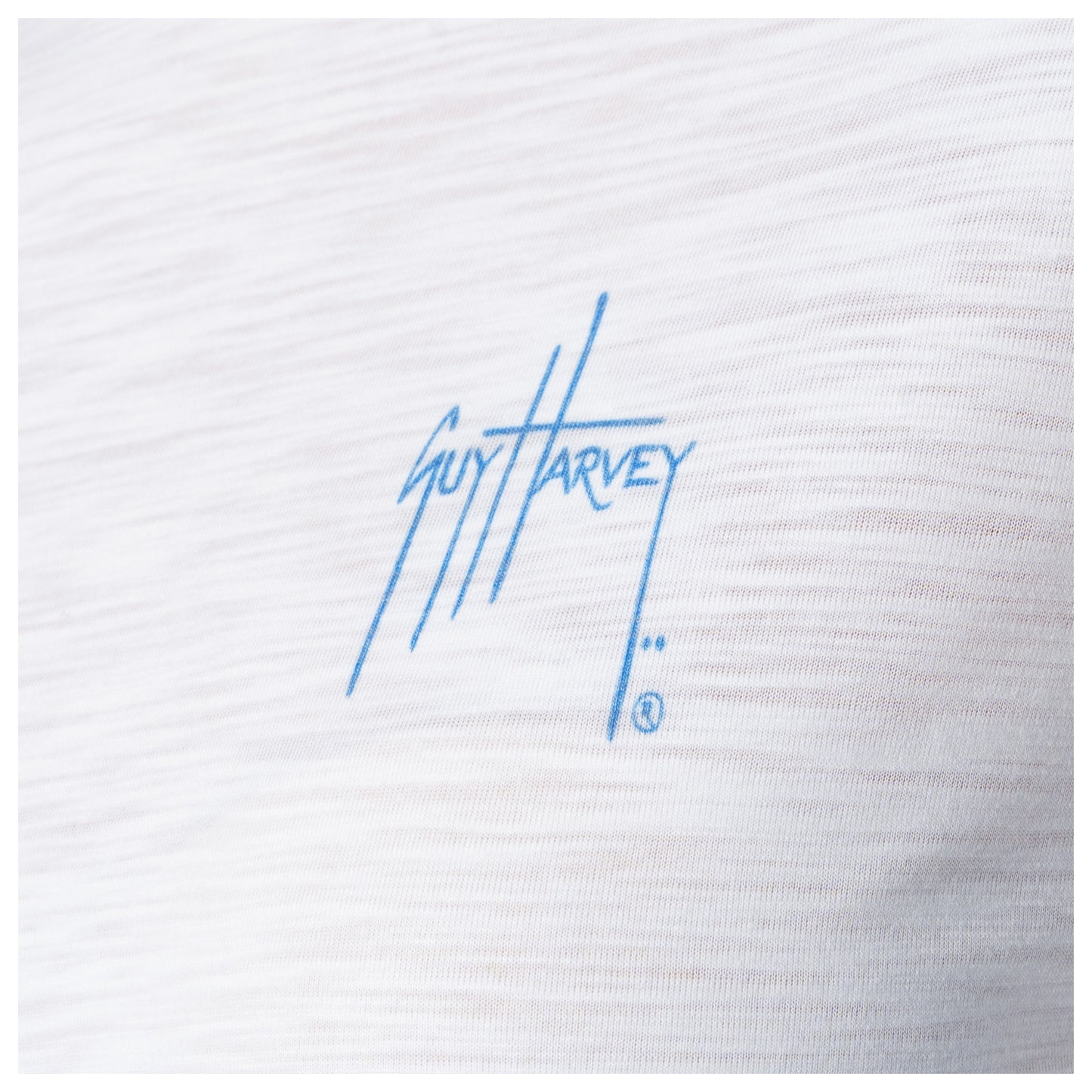 White fabric with blue 'Guy Harvey' logo