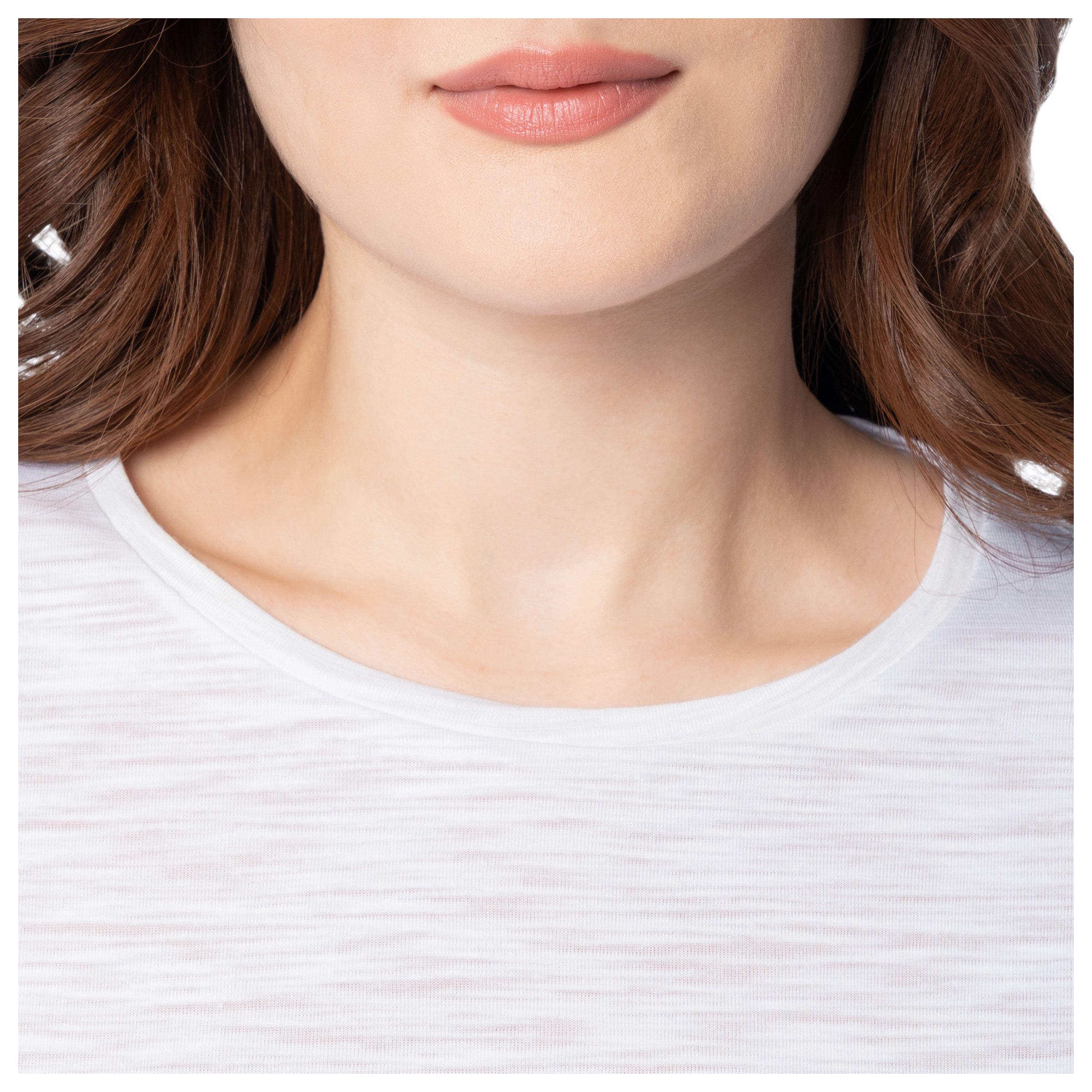 Close-up of a person wearing a white shirt with a blurred background