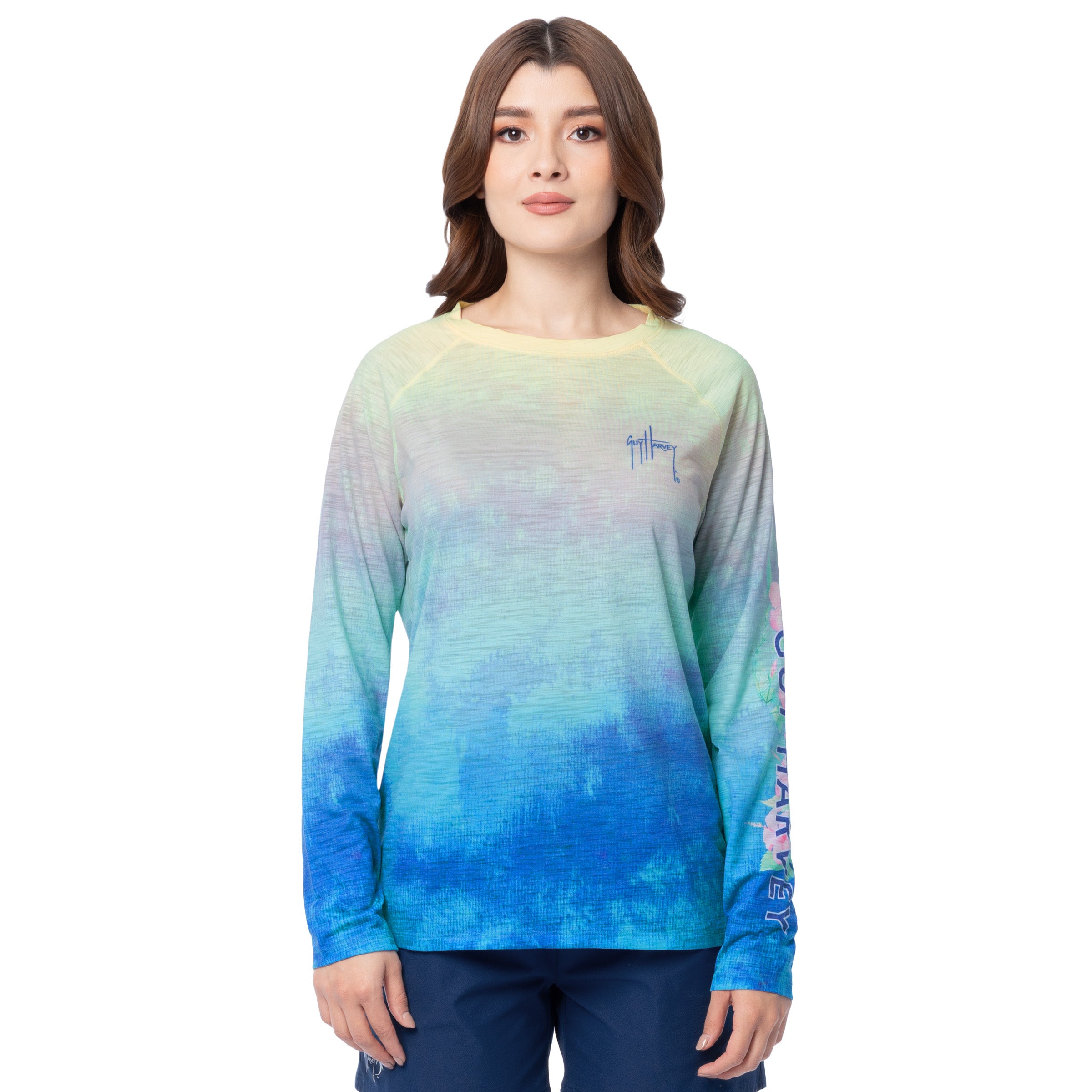 Woman wearing a long-sleeve shirt with a gradient design on a white background