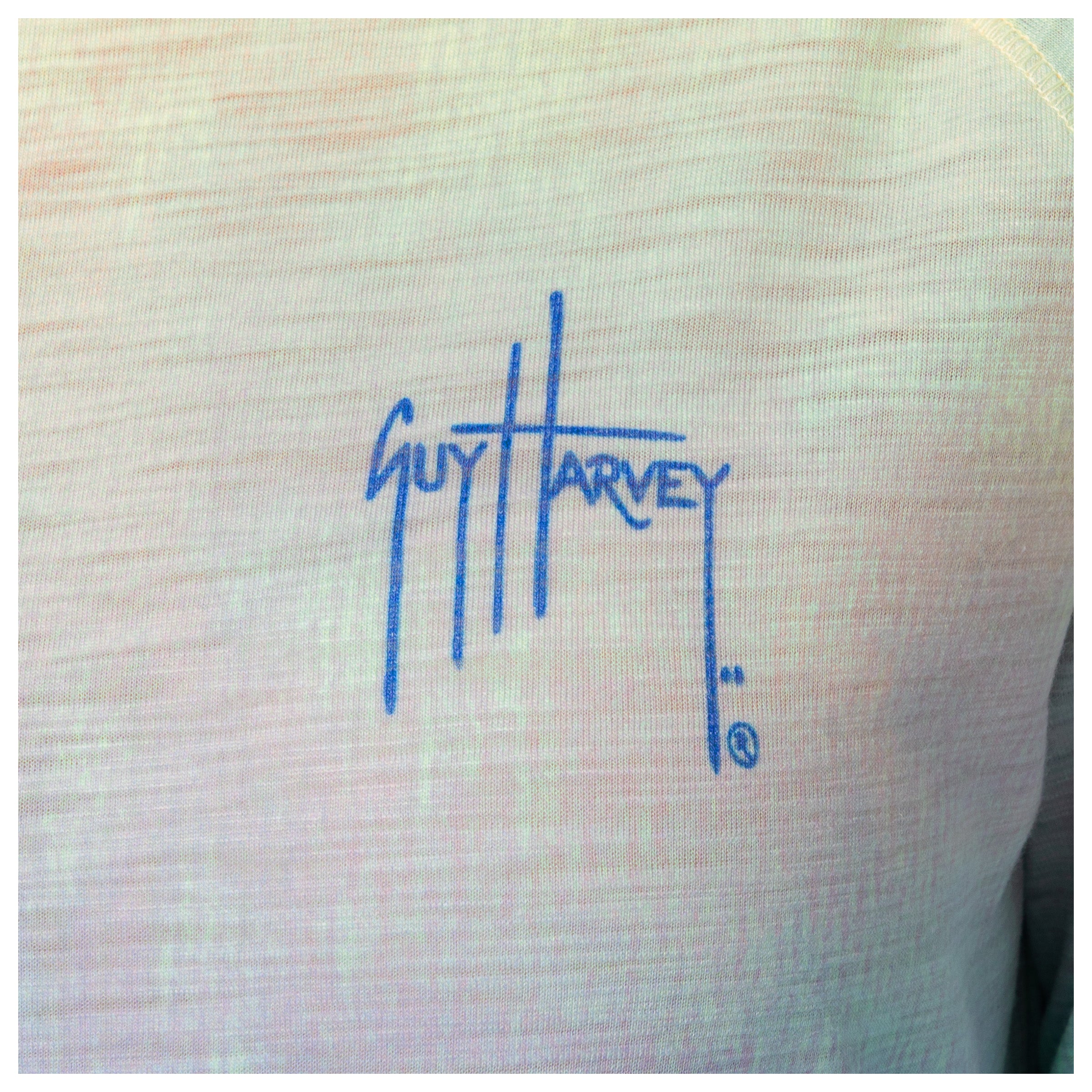 Blue logo of 'Guy Harvey' on a the left chest