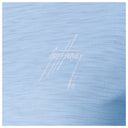 Light blue fabric with a white logo and text