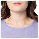 Close-up of a person wearing a light purple shirt with a neutral background
