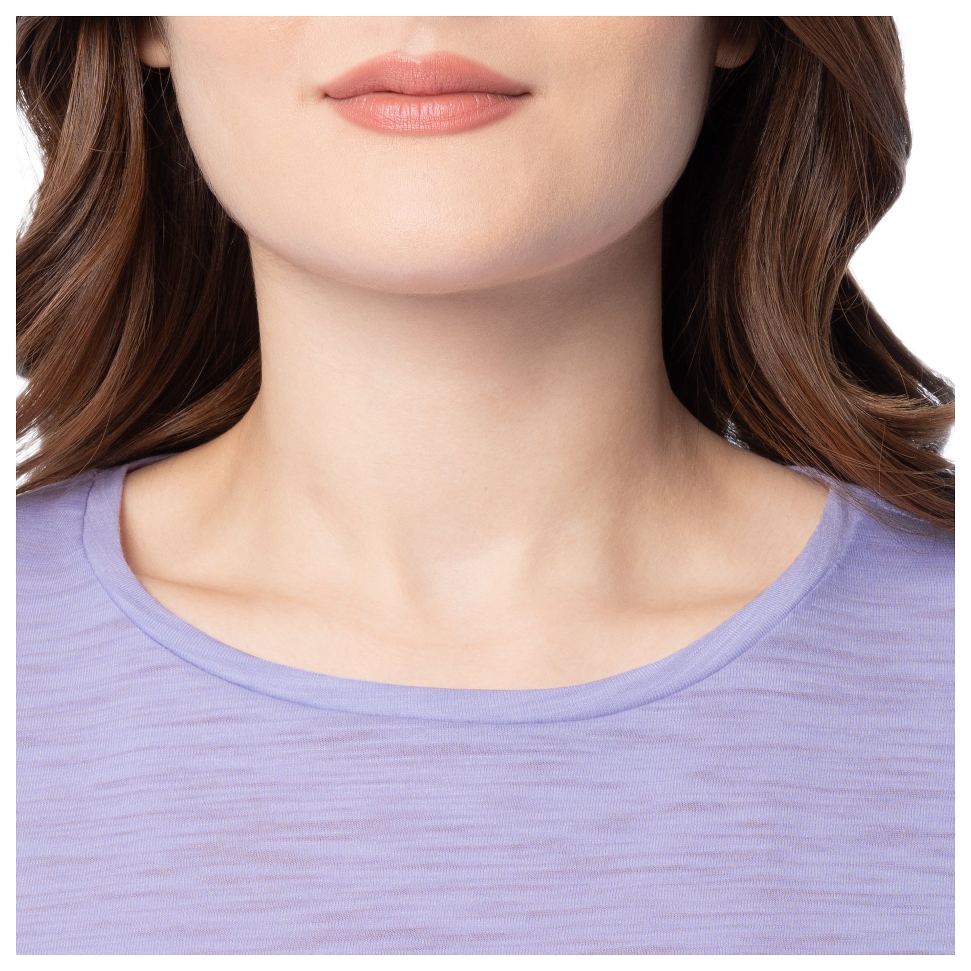 Close-up of a person wearing a light purple shirt with a neutral background