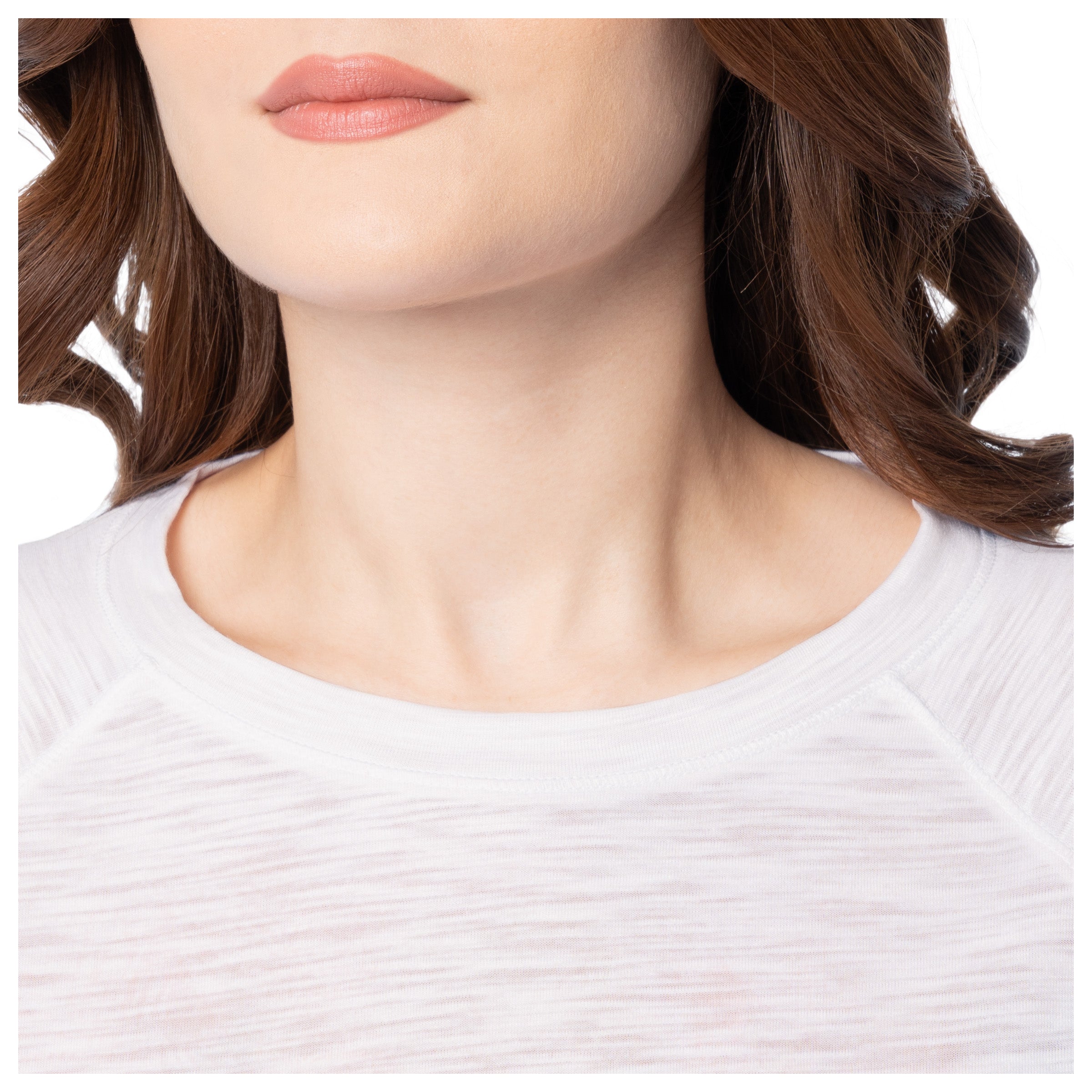 Close-up of a person wearing a white shirt with a blurred background