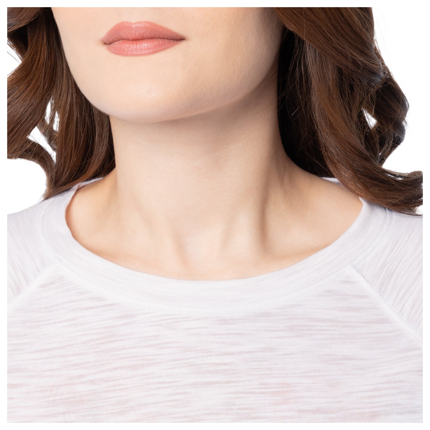 Close-up of a person wearing a white shirt with a blurred background