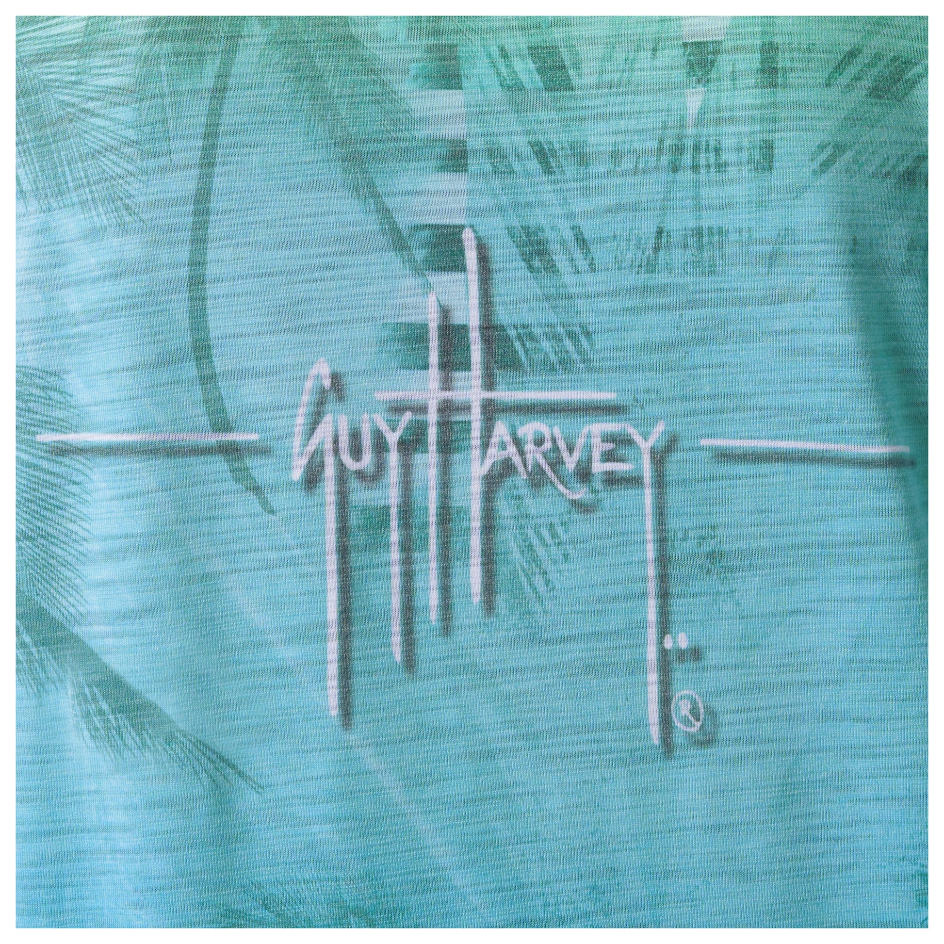Guy Harvey logo on a textured teal background