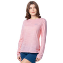 Woman wearing a pink long-sleeve shirt on a white background