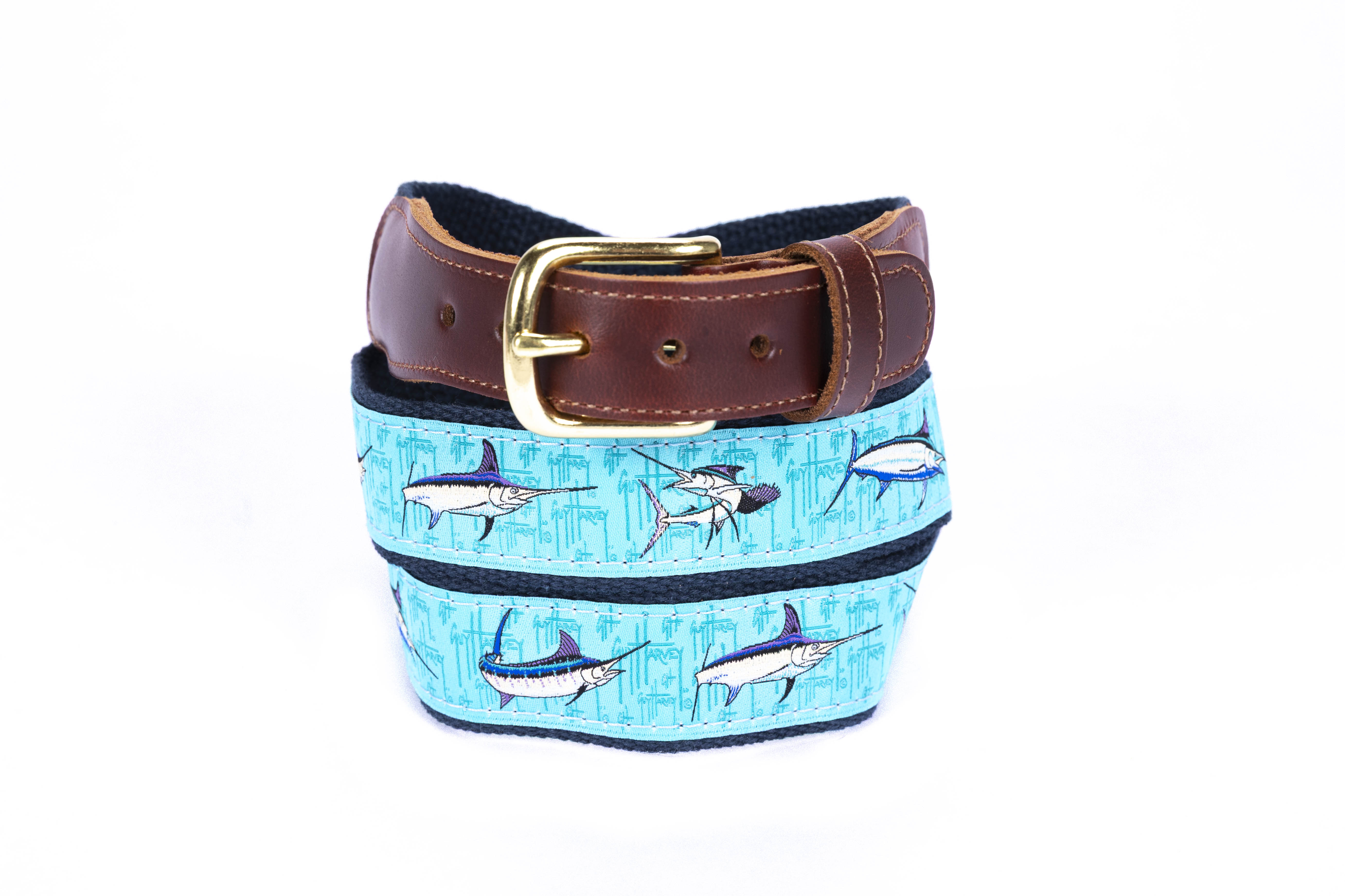 Guy Harvey Men’s Bill Fish Collage Leather Tab Belt with aqua cotton webbing, colorful billfish artwork, brown leather tabs, and brass buckle