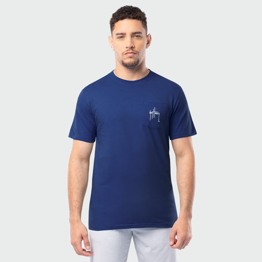 Man wearing a blue t-shirt with a Guy Harvey logo on a light gray background