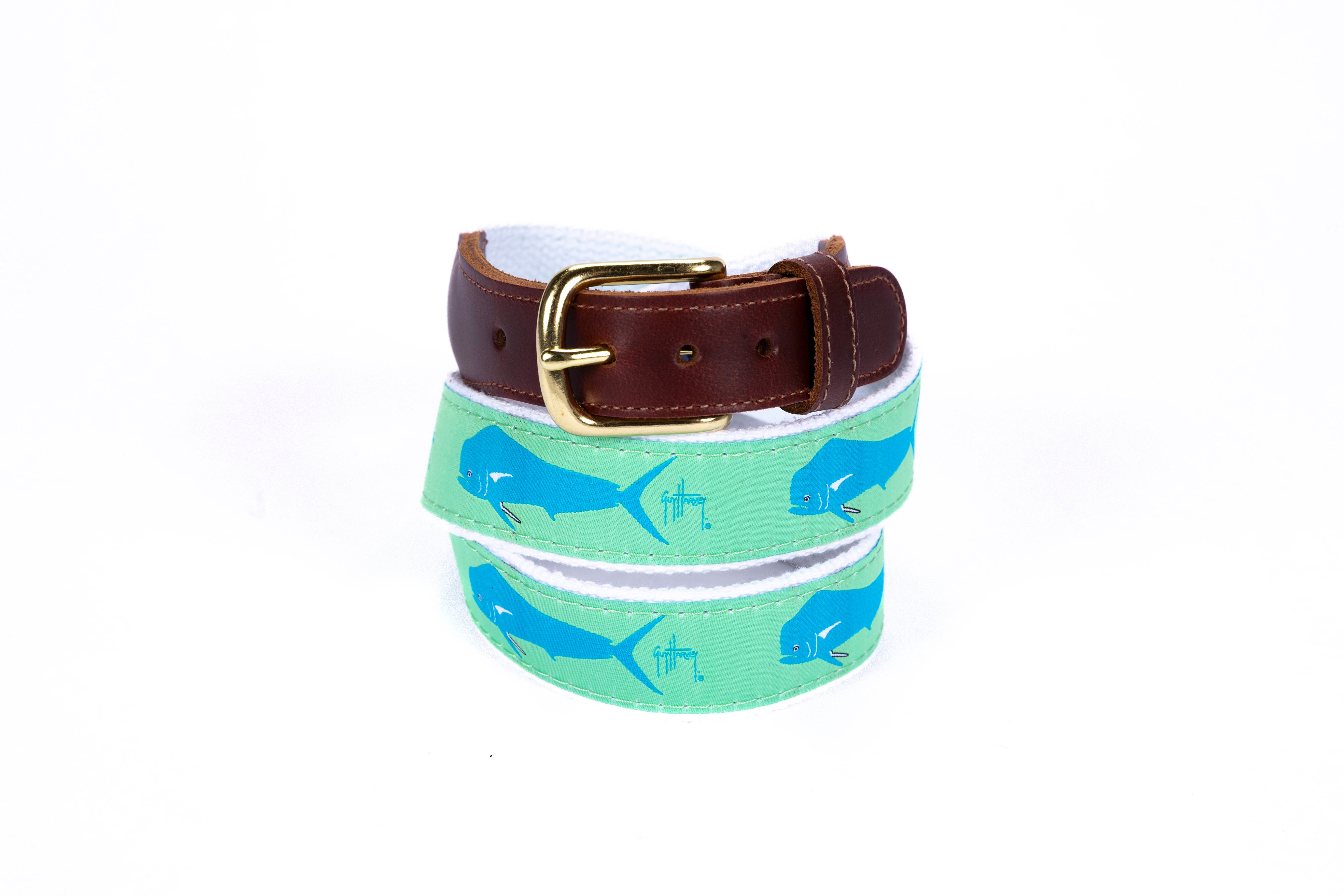 Guy Harvey Men’s Dorado on Green Leather Tab Belt with green cotton webbing, blue dorado fish artwork, brown leather tabs, and brass buckle.