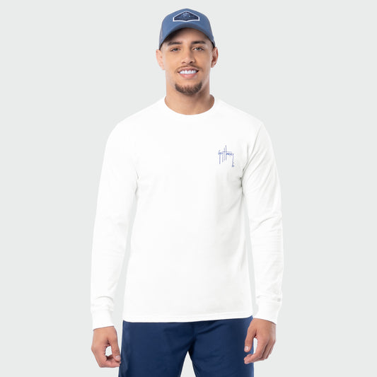 Man wearing a white long-sleeve shirt with a Guy Harvey logo on a gray background