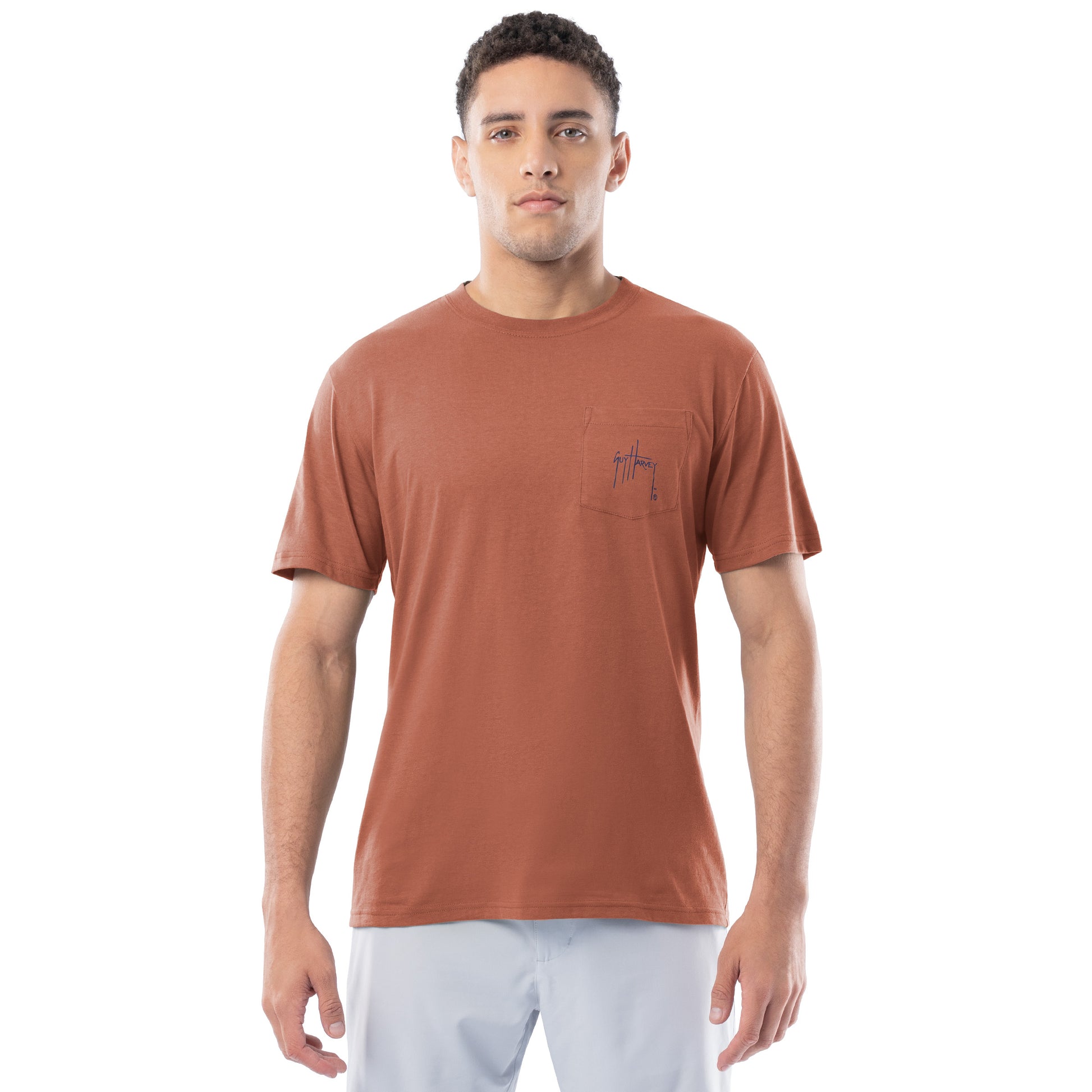 Man wearing a brown t-shirt with a Guy Harvey logo on a white background